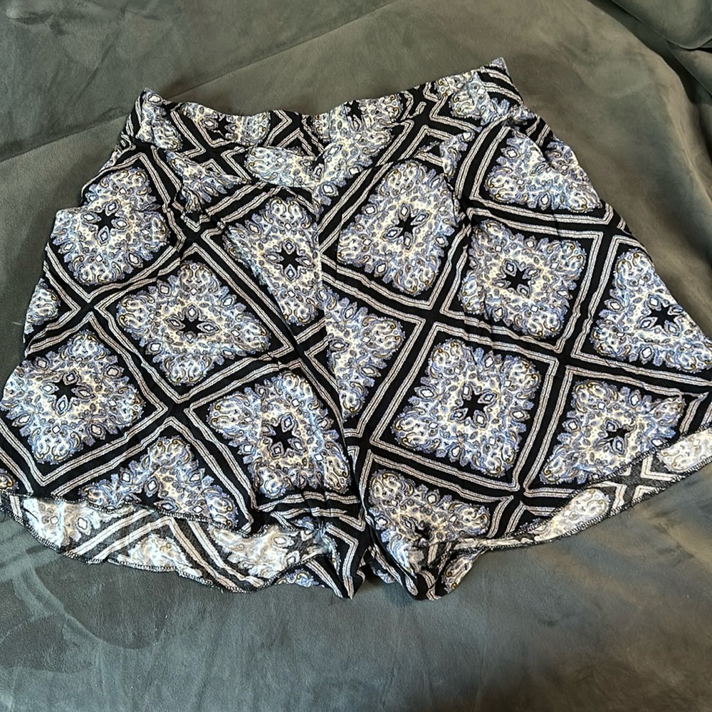 Blue patterned shorts size 12, elastic waist bands and pockets. Soft and flowy.